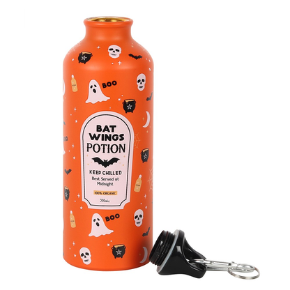 An orange bottle with Halloween inspired decoration and 'Bat Wings Potion' imitation label. 