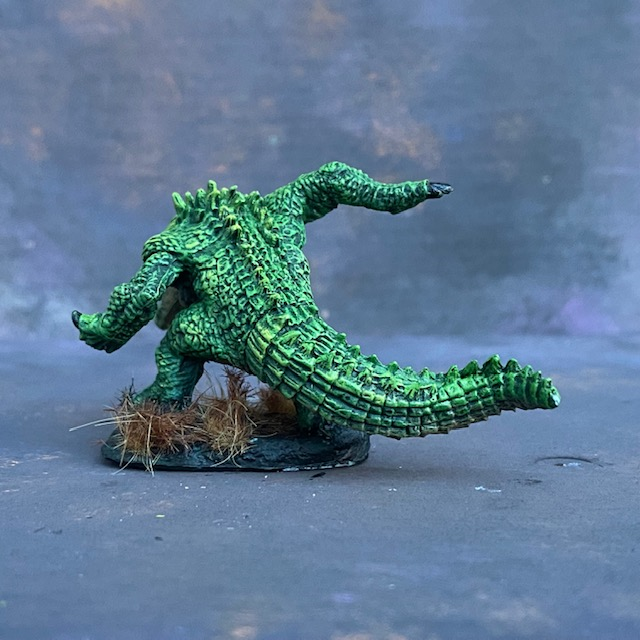 Werecrocodile by Reaper Miniatures from their Bones range pre painted by Mrs MLG.  A bones miniature of giant crocodile painted in greens.