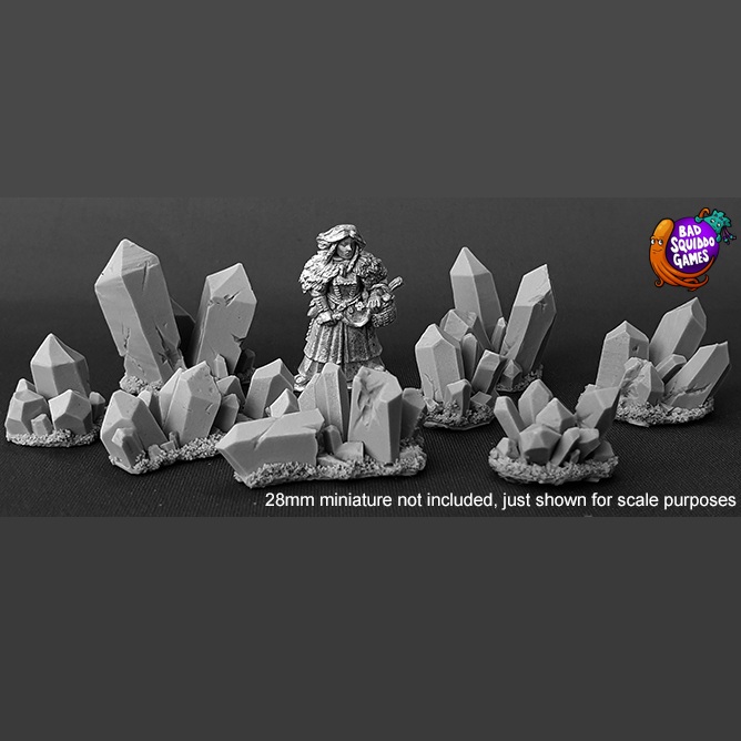 Crystals by Bad Squiddo Games contains 8 pieces of lovely sculpted resin crystals shown with human mini