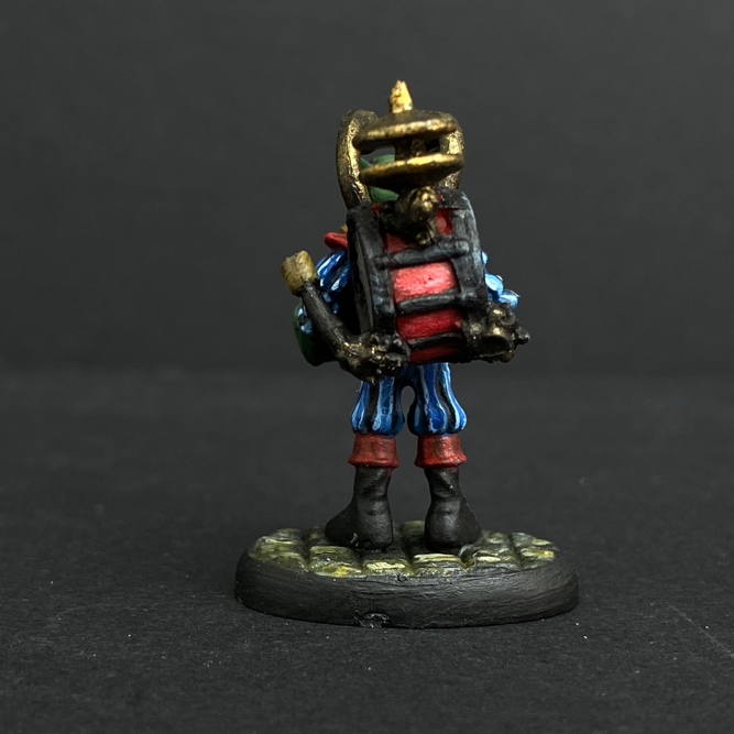 Hand painted one man band from the Reaper Miniatures range. Mrs MLG has painted this wonderful little goblin playing all his instruments for the one man band using a blue and red colour scheme for his clothing. 