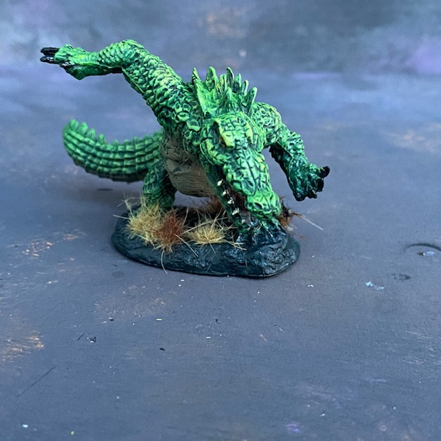 Werecrocodile by Reaper Miniatures from their Bones range pre painted by Mrs MLG.  A bones miniature of giant crocodile painted in greens.