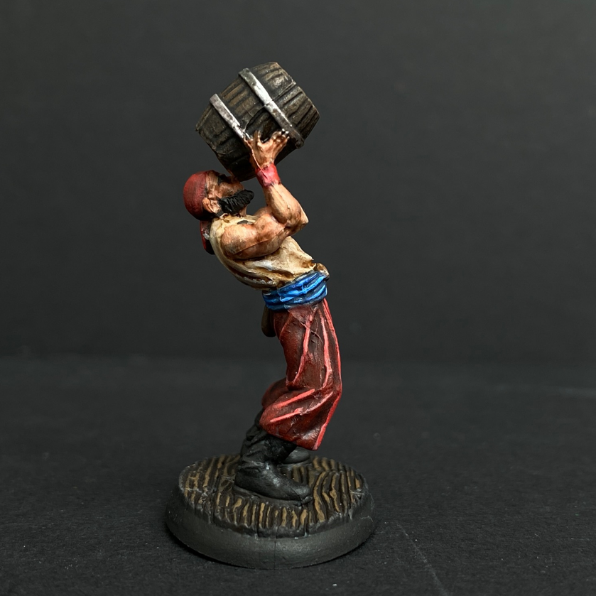 Hand painted pirate from the Reaper Miniatures range. Mrs MLG has painted this pirate who is drinking directly from a barrel with red trousers and white shirt. 