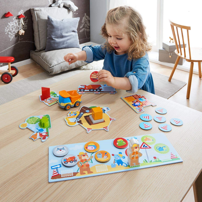 Building Site -My Very First Games. Girl playing with the game