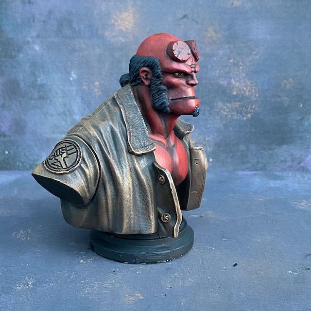 A Mantic Games bust of Hell Boy in resin with his classic manbun and brown jacket