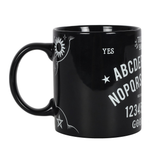 side view of black mug with white sun and pentagram design 