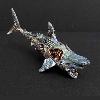 Hand painted zombie shark from the Reaper Miniatures range. Mrs MLG has hand painted this undead zombie shark including blood and puss effects.Hand painted zombie shark from the Reaper Miniatures range. Mrs MLG has hand painted this undead zombie shark including blood and puss effects.