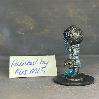 A Reaper Miniatures bonesylvanian Jaques hand painted by Mrs MLG. This scientist may have taken his experiments too far as he now has the head and one hand of a bug. Mrs MLG has painted this little fella with his glass flask broken and the contents spilling out onto the floor. 