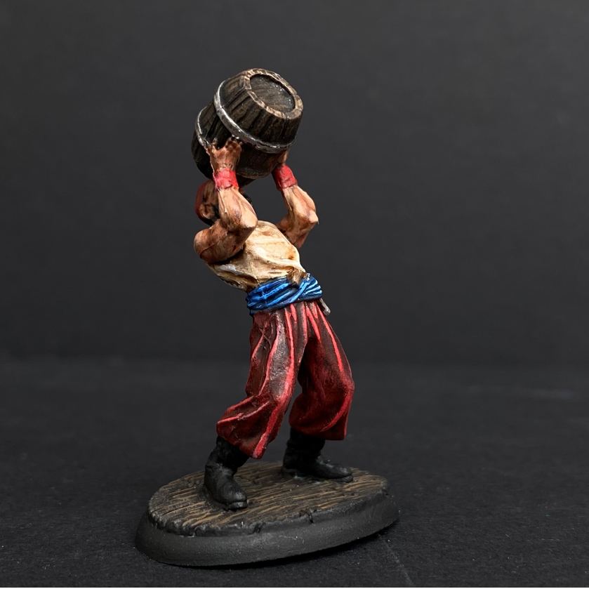 Hand painted pirate from the Reaper Miniatures range. Mrs MLG has painted this pirate who is drinking directly from a barrel with red trousers and white shirt. 