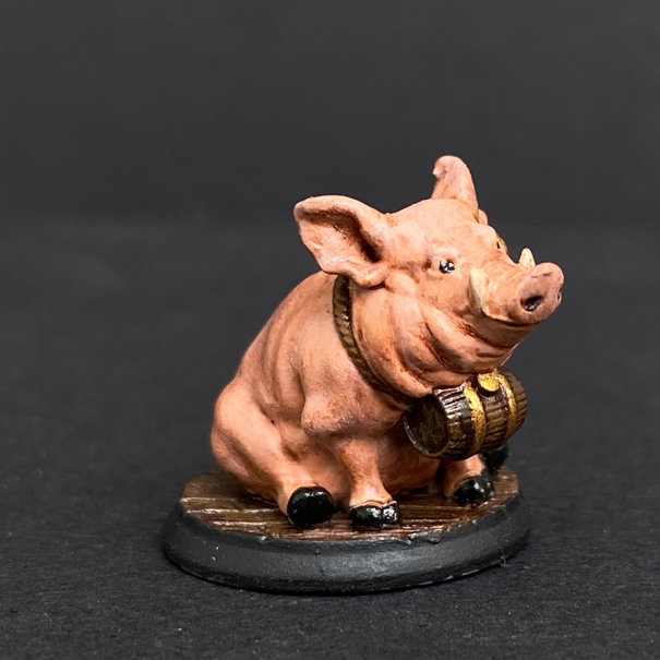 Hand painted pig with a barrel from the Reaper Miniatures range. Mrs MLG has painted this cute little pig with pink colouring, gold earing and black hooves.