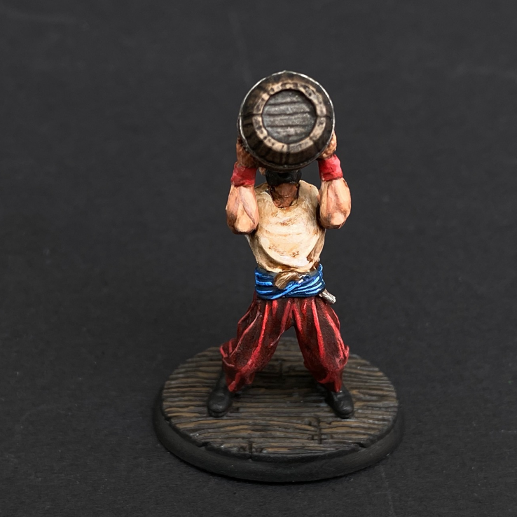 Hand painted pirate from the Reaper Miniatures range. Mrs MLG has painted this pirate who is drinking directly from a barrel with red trousers and white shirt. 