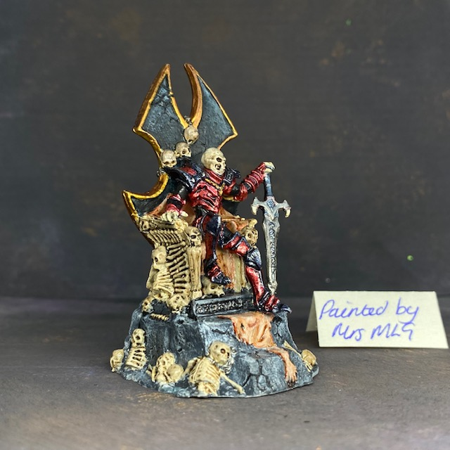 Dragoth pre painted by Mrs MLG. Dragoth sat on his throne with one hand on his sword, his throne is made from bones and skin 