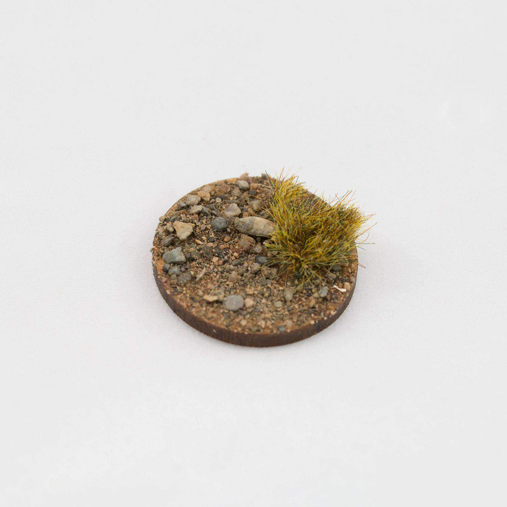 Dead 6mm tufts by Geek Gaming Scenics , shown here on a base with sand and rocks