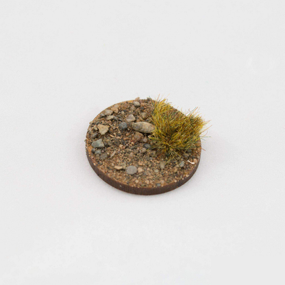 Dead 6mm tufts by Geek Gaming Scenics , shown here on a base with sand and rocks