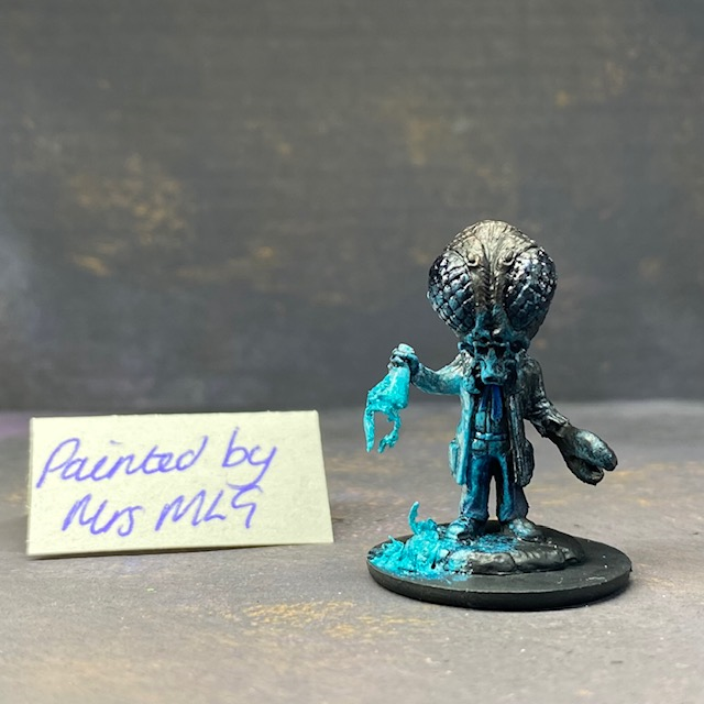 A Reaper Miniatures bonesylvanian Jaques hand painted by Mrs MLG. This scientist may have taken his experiments too far as he now has the head and one hand of a bug. Mrs MLG has painted this little fella with his glass flask broken and the contents spilling out onto the floor. 