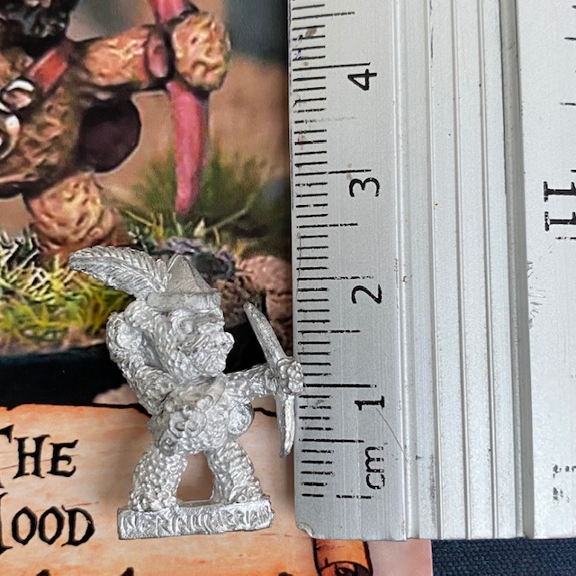 The Hood by Northumbrian Tin Solider is a metal teddy bear miniature wearing a feather adorned cap and firing a bow, full of character this teddy bear sports a moustache and goatee